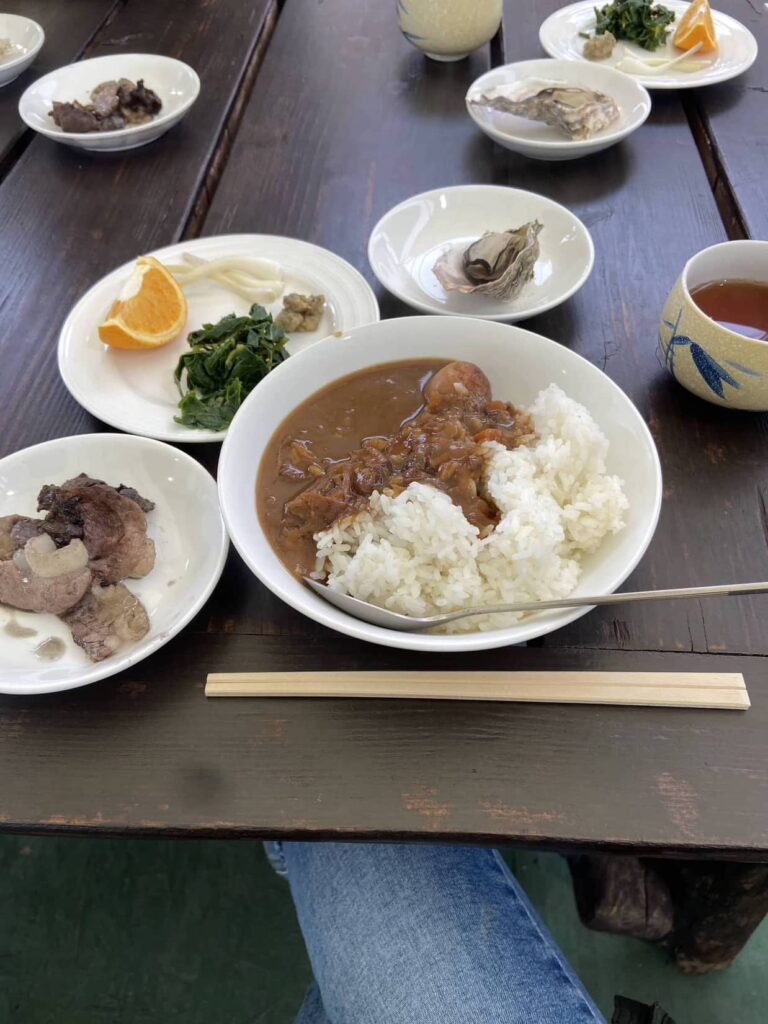 Lunch on Day 1. Charcoal-grilled wild boar and wild boar curry, plump oysters, kyousei farming vegetables and fruits.