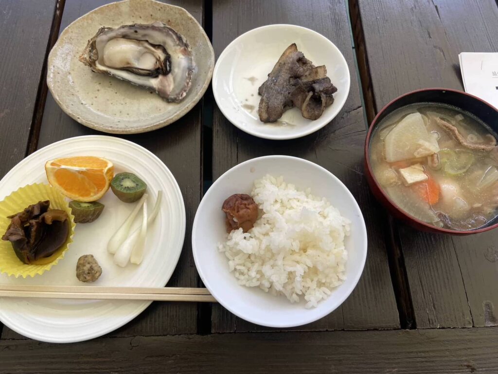 Lunch on the second. Wild boar soup, rice, grilled oyster, and fruits